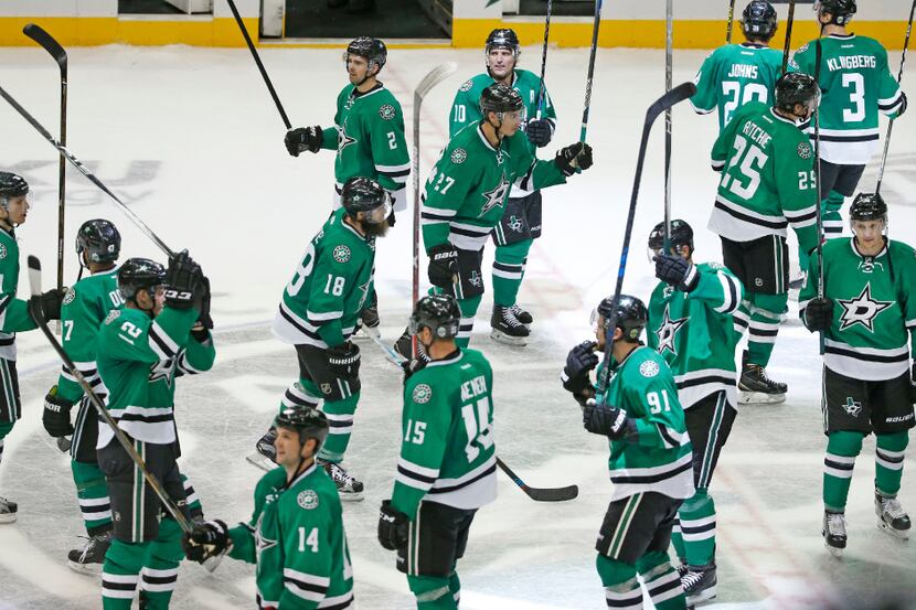 Dallas players salute the fans before they head to the locker room after winning 4-2 during...