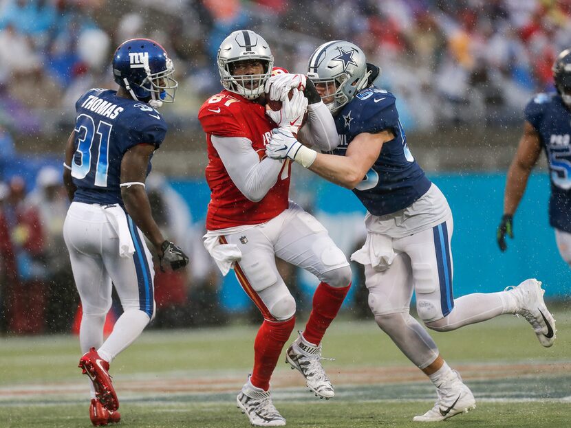 Tight End Jared Cook #87 of the Oakland Raiders from the AFC Team makes a catch over Safety...