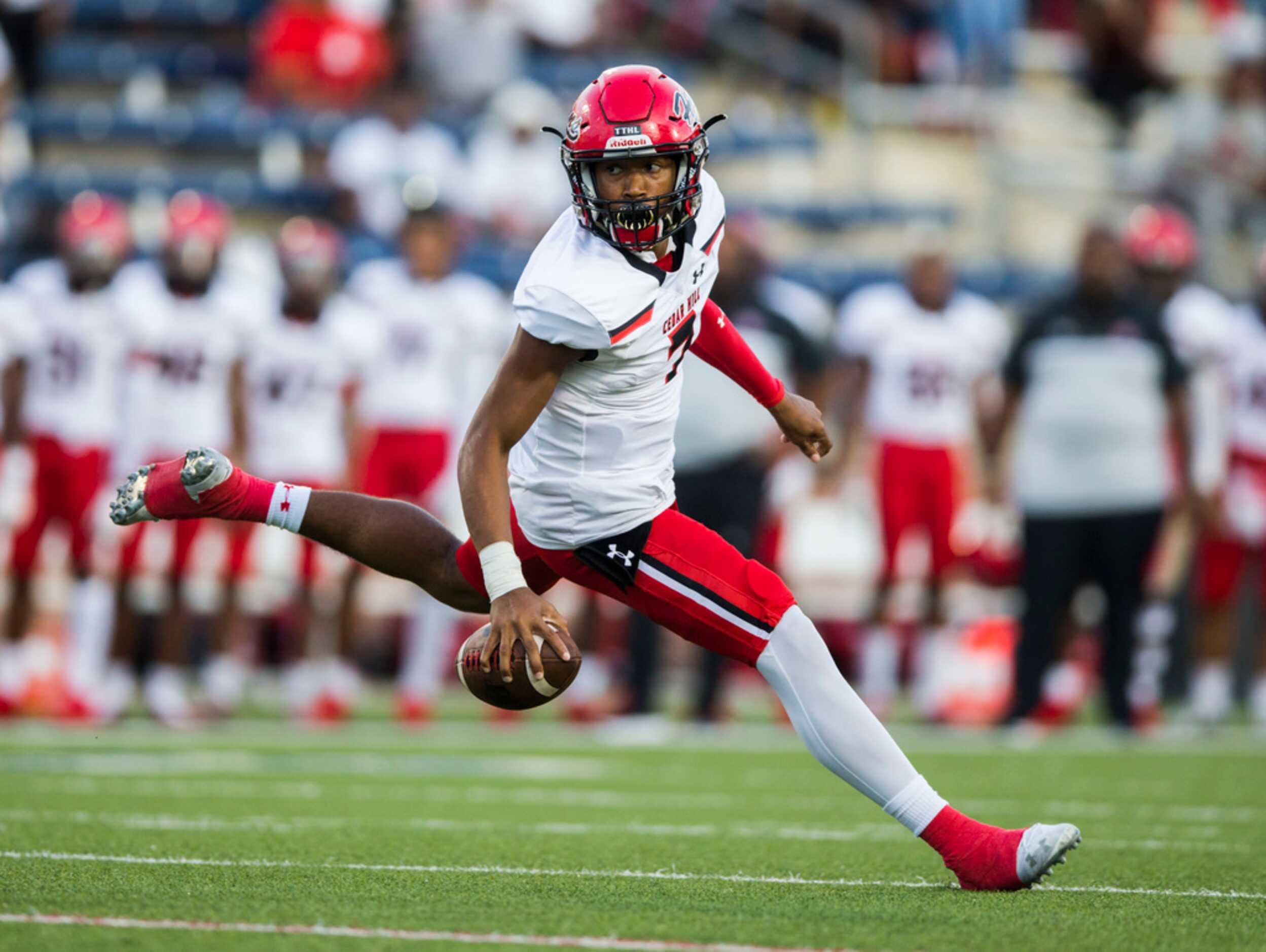 Cedar Hill quarterback Kaidon Salter (7) scrambles during the first quarter of a high school...