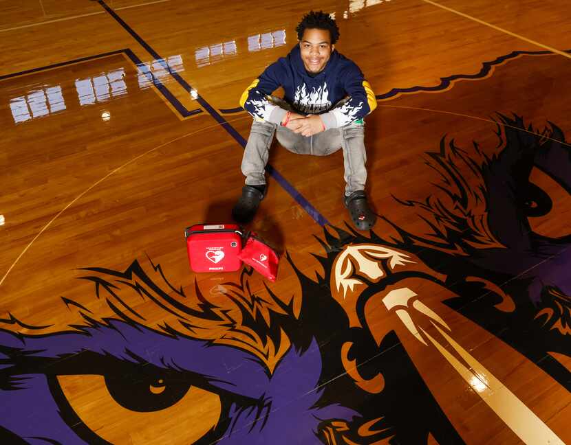 Kamathi Long sits next to a defibrillator on Tuesday, Jan. 10, 2023, in the gym where Long...