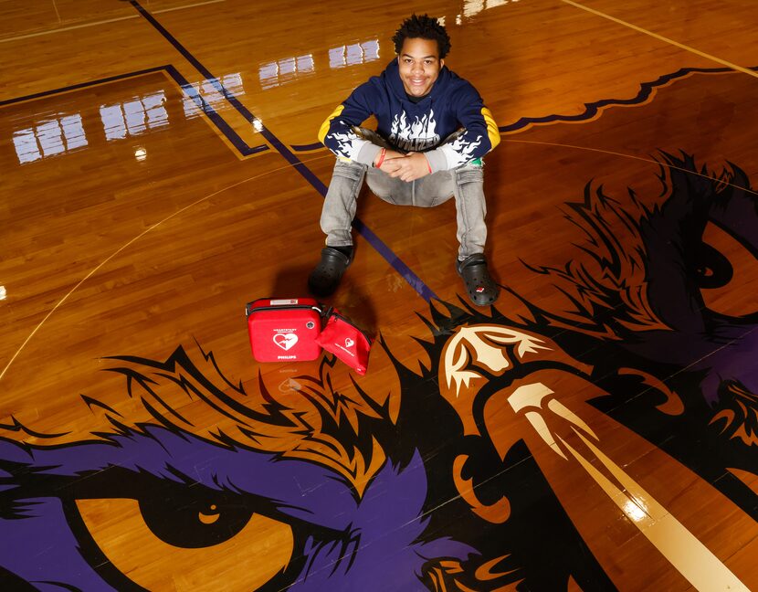 Kamathi Long sits next to a defibrillator on Tuesday, Jan. 10, 2023, in the gym where Long...