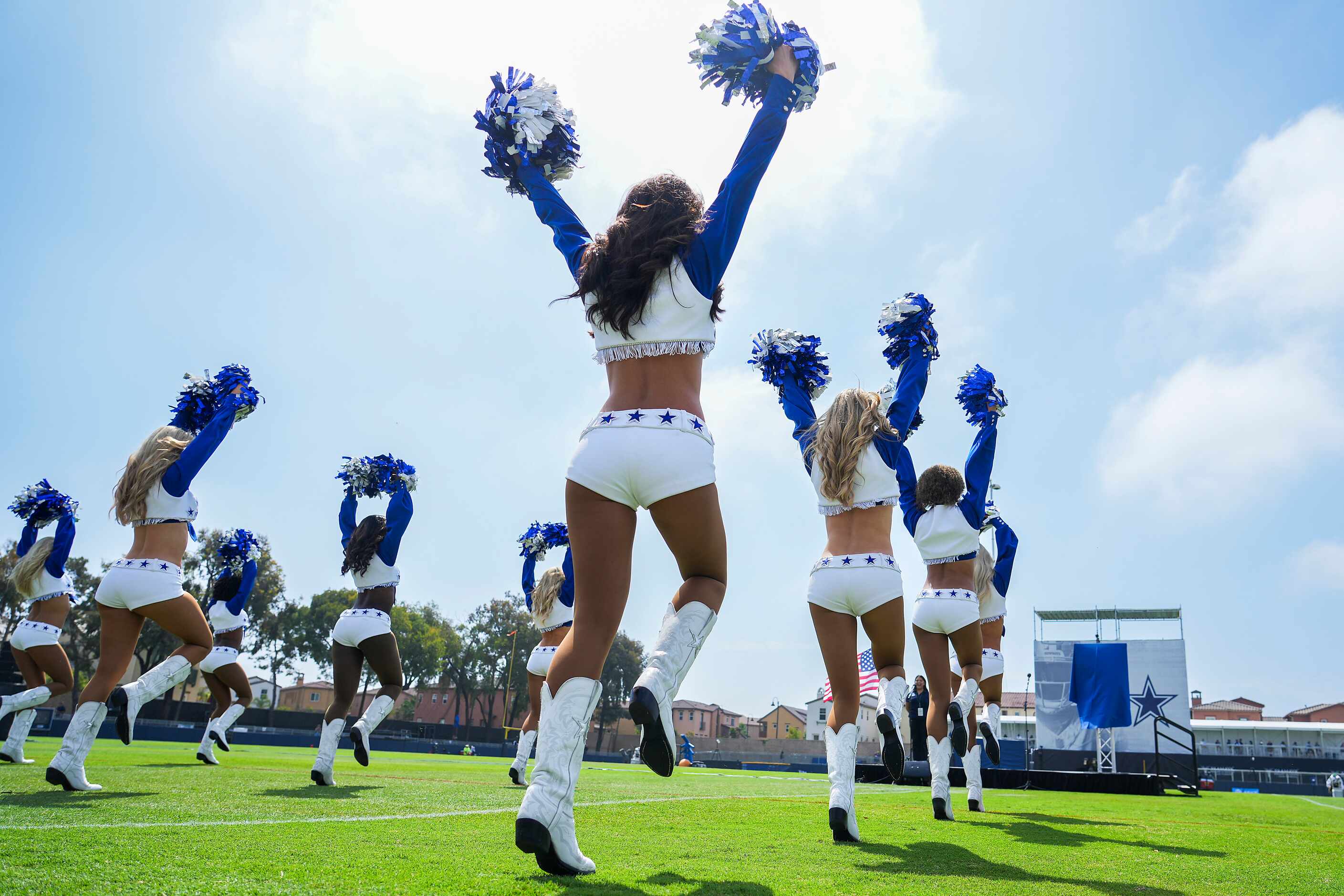 The Dallas Cowboys Cheerleaders perform during opening ceremonies before a training camp...