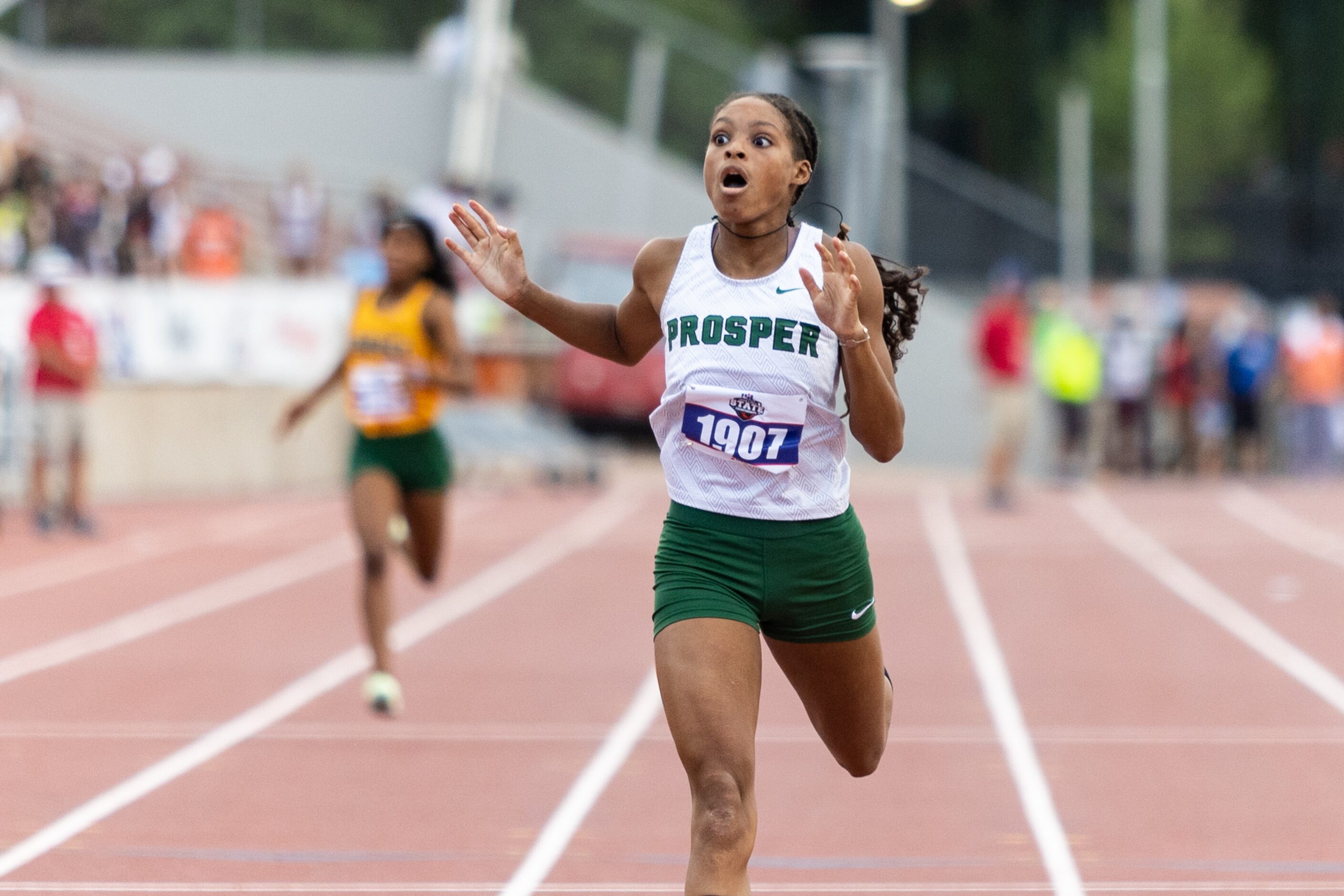 Lauren Lewis of Prosper reacts to winning the girls’ 400-meter dash at the UIL Track & Field...