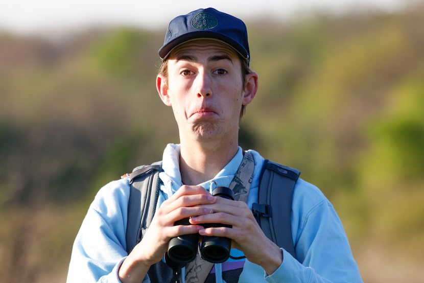 Birdwatcher Kalder Korte, reacts after spotting a certain bird at Harry S Moss Park, on...