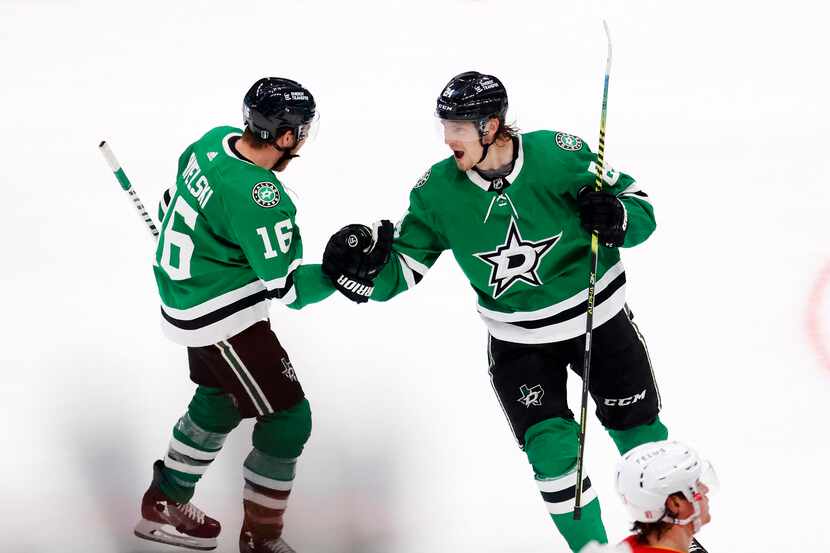 Dallas Stars center Roope Hintz (24) is congratulated on his third period empty net goal by...