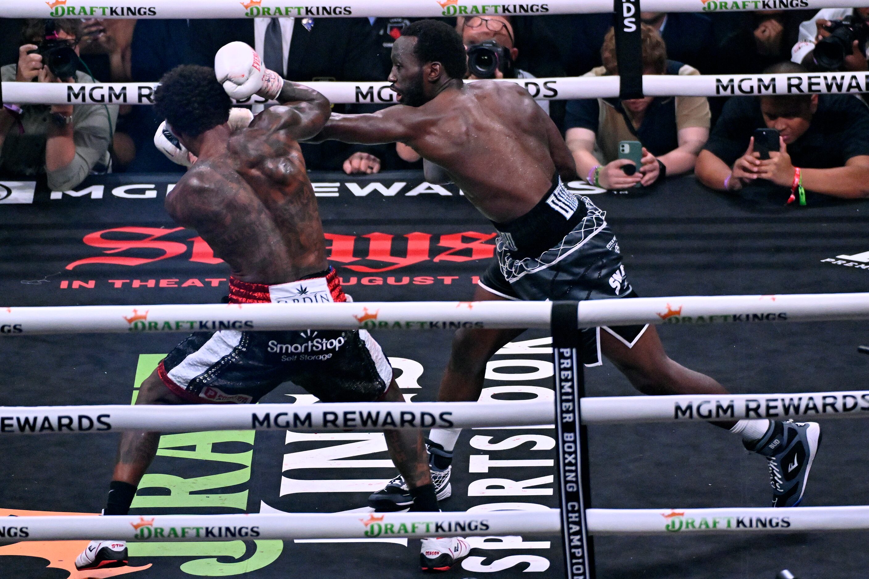 Terence Crawford, right, and Errol Spence Jr. fight during their undisputed welterweight...