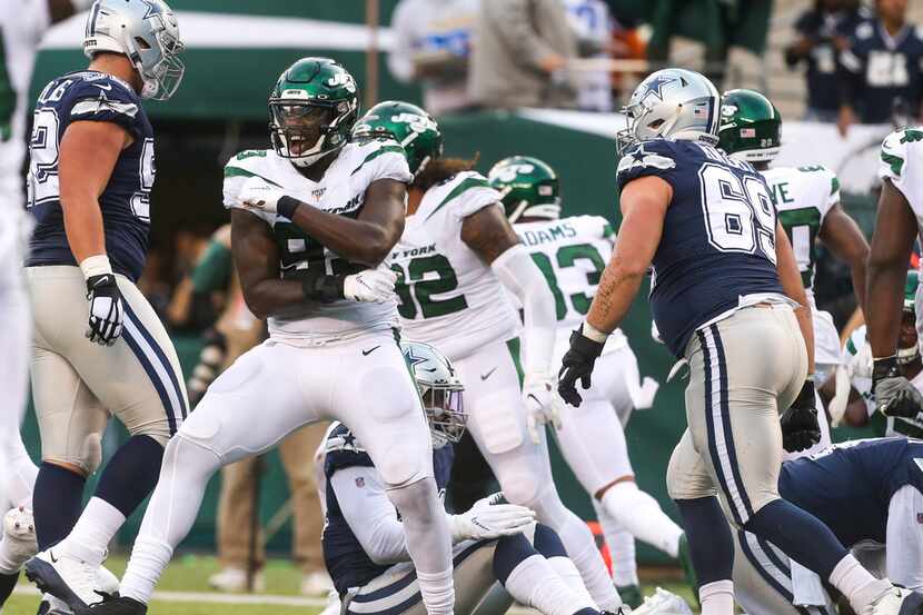New York Jets linebacker Tarell Basham (93) celebrates after stopping the Cowboys on a 4th...