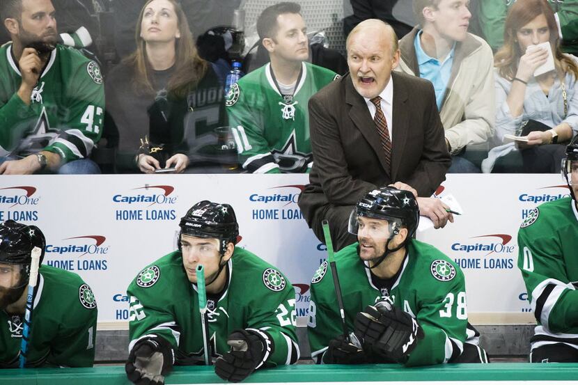 Dallas Stars head coach Lindy Ruff yells from the bench during the second period of an NHL...