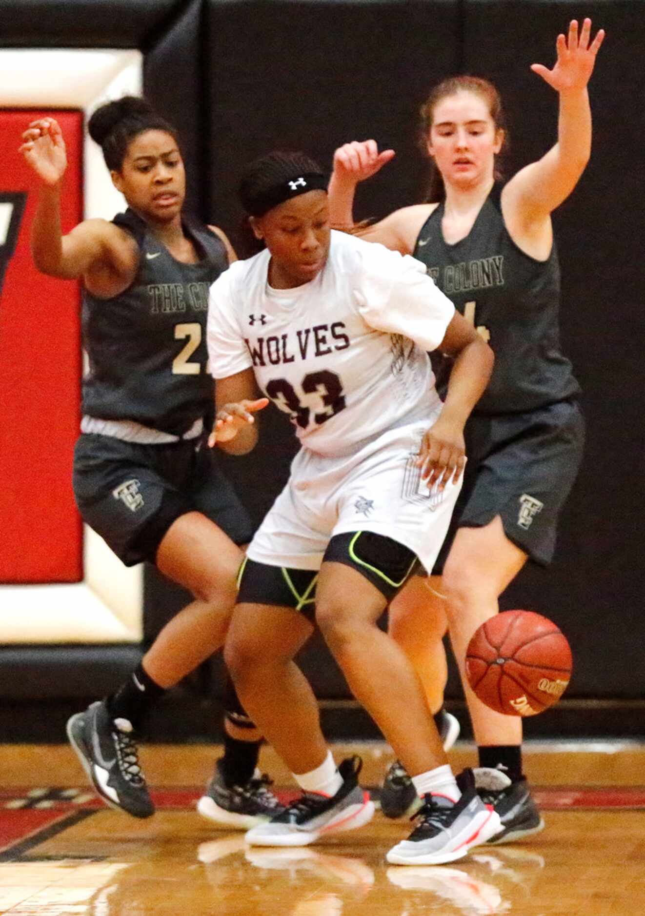 Timberview High School forward Destiny Burton (33) looses the basketball as she is defended...