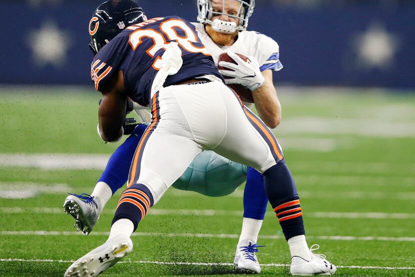 Dallas Cowboys wide receiver Cole Beasley (11) is hit by Chicago Bears free safety Adrian...