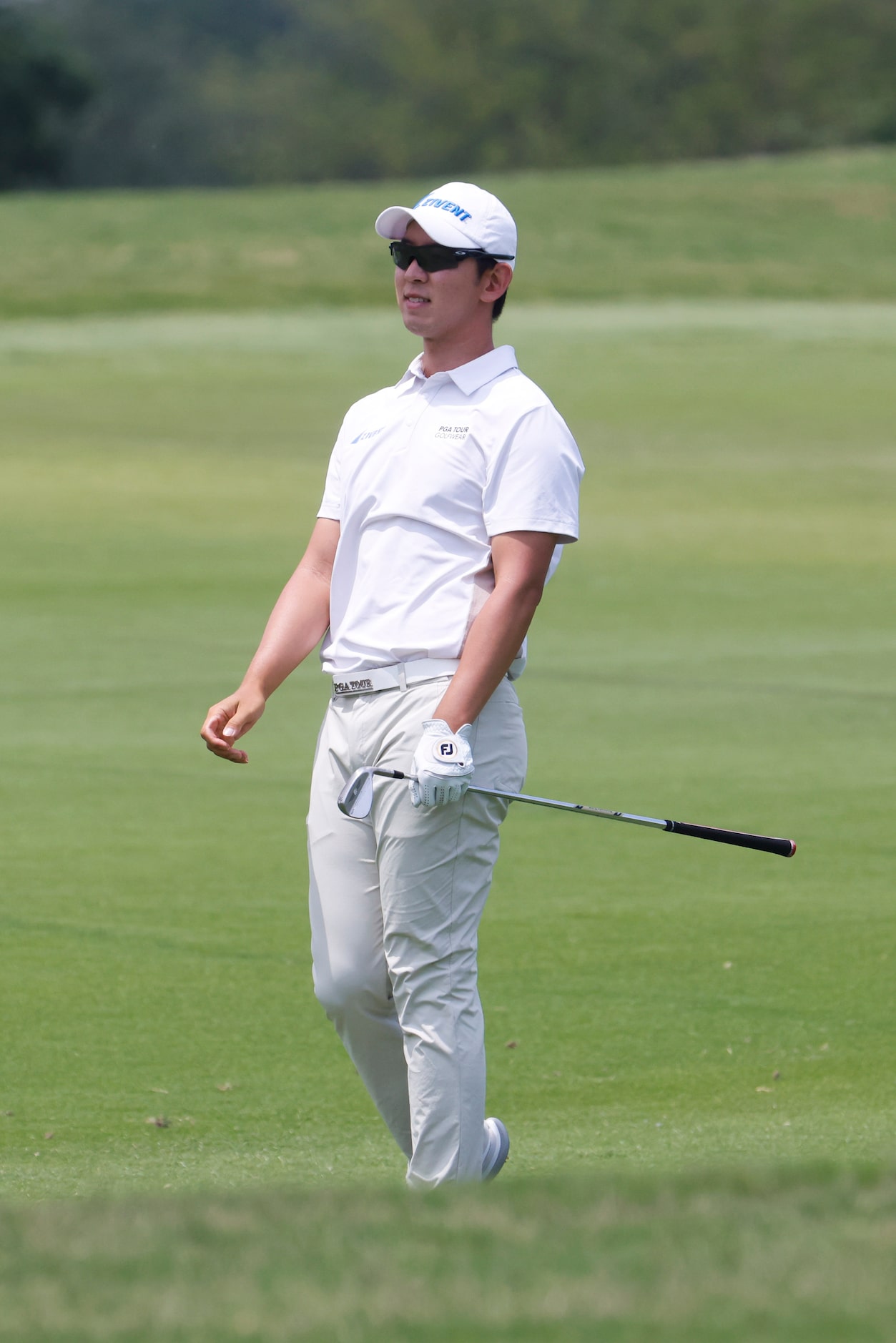 S.Y. Noh of South Korea watches as he hits from the fairway on the 18th hole during the...