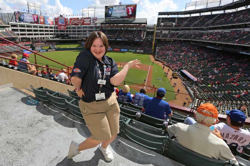 Texas Rangers usher Hannah Speirs shows her dance moves as she is pictured in Section 224...