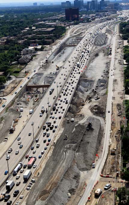 Construction work continues of LBJ Freeway looking west toward the Dallas North Tollway on...