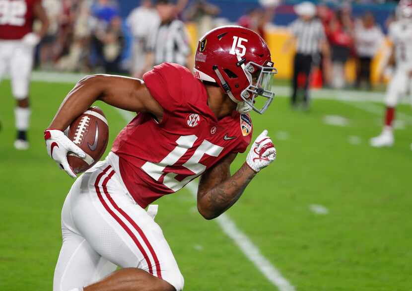 FILE - Alabama defensive back Xavier McKinney (15) runs the ball, during the first half of...