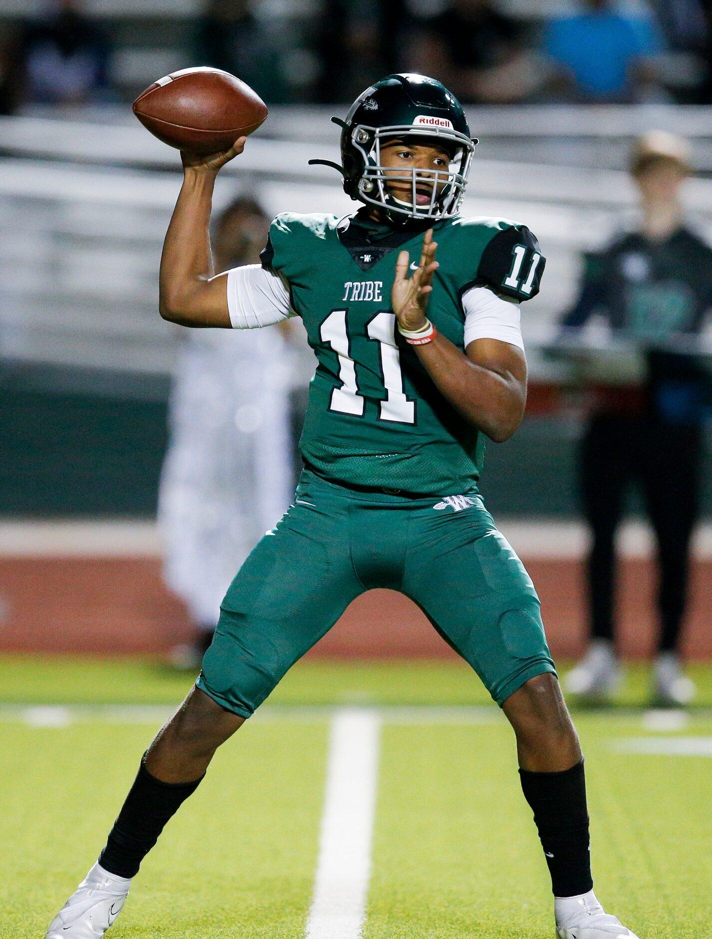 Waxahachie sophomore quarterback Roderick Hartsfield (11) throws during the first half of a...