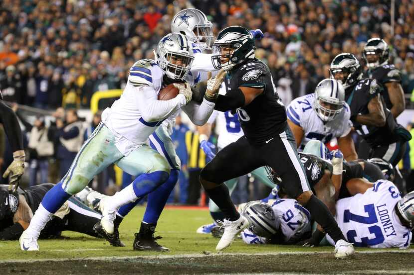 Dallas Cowboys running back Ezekiel Elliott (21) scores a a touchdown against Philadelphia...