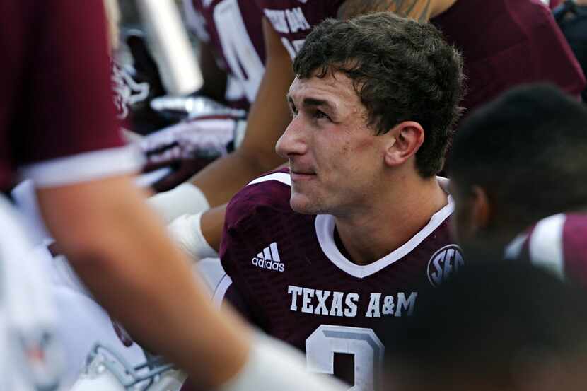 Texas A&M Aggies quarterback Johnny Manziel (2) looks on from the bench during the second...