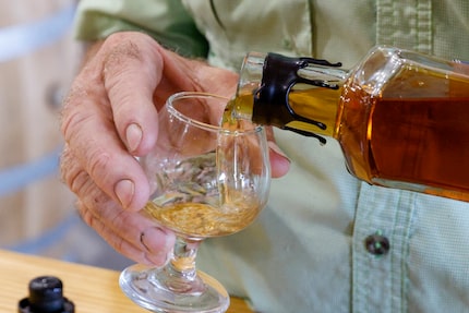 Master distiller and Whiskey Hollow founder Les Beasley pours a glass of his Texas Gold...