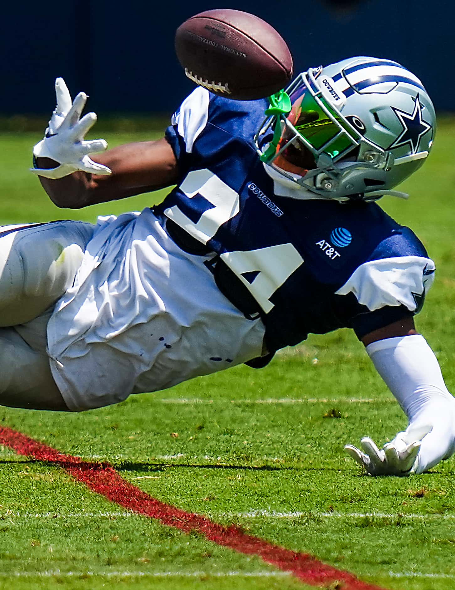 Dallas Cowboys safety Israel Mukuamu (24) can’t come up with an interception after breaking...
