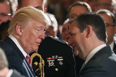 President Donald Trump talks with Texas Sen. Ted Cruz during a White House event regarding...