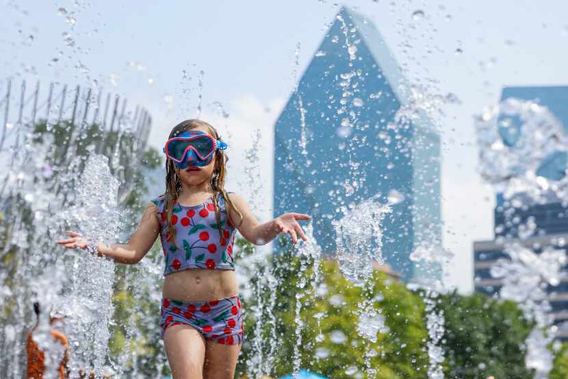 Vivian Sanford, 10, walks through a water fountain June 15 at Klyde Warren Park in Dallas.