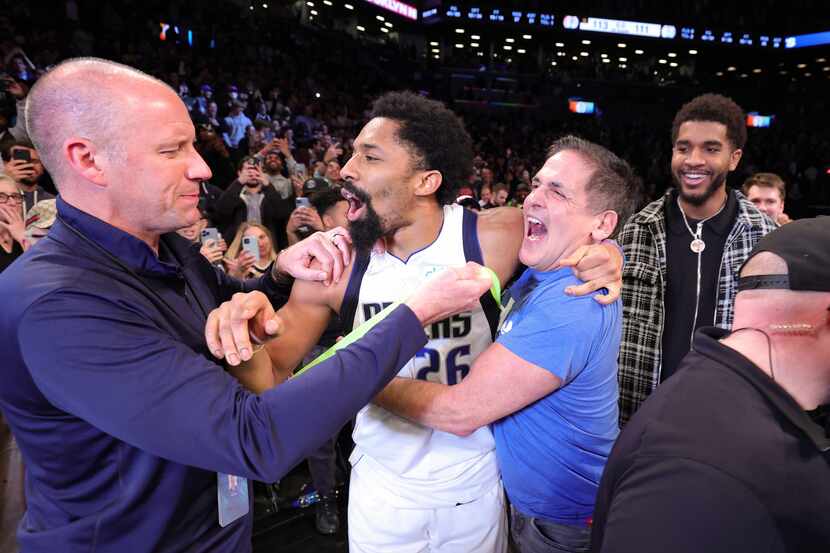 Dallas Mavericks Owner, Mark Cuban celebrates with Spencer Dinwiddie #26 of the Dallas...