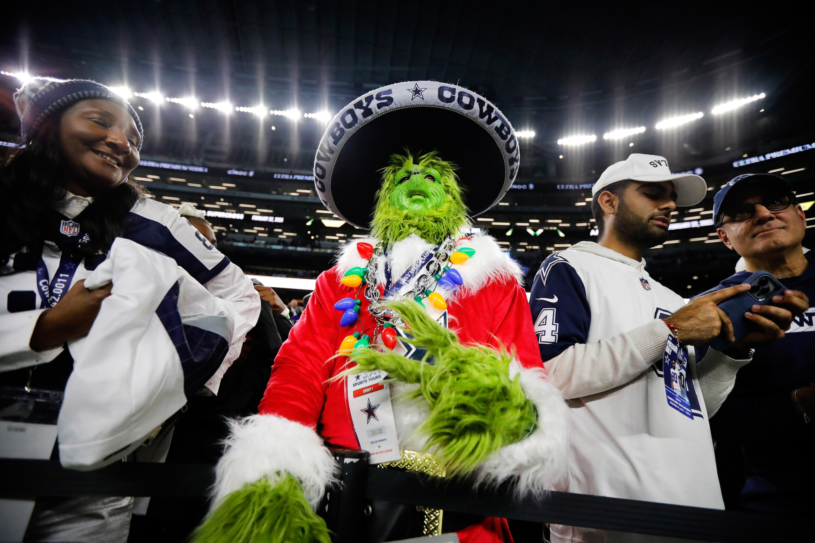 Dallas Cowboys fan Chris Raiser of S. Florida  dressed as the Grinch as he watched pregame...