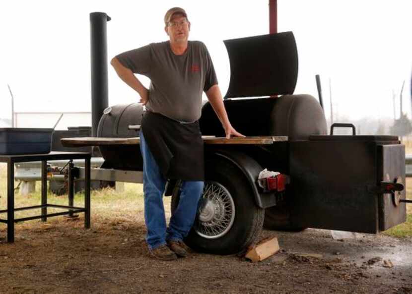 
Pit boss and owner Terry Massey and his smoker at Lazy S&M BBQ
