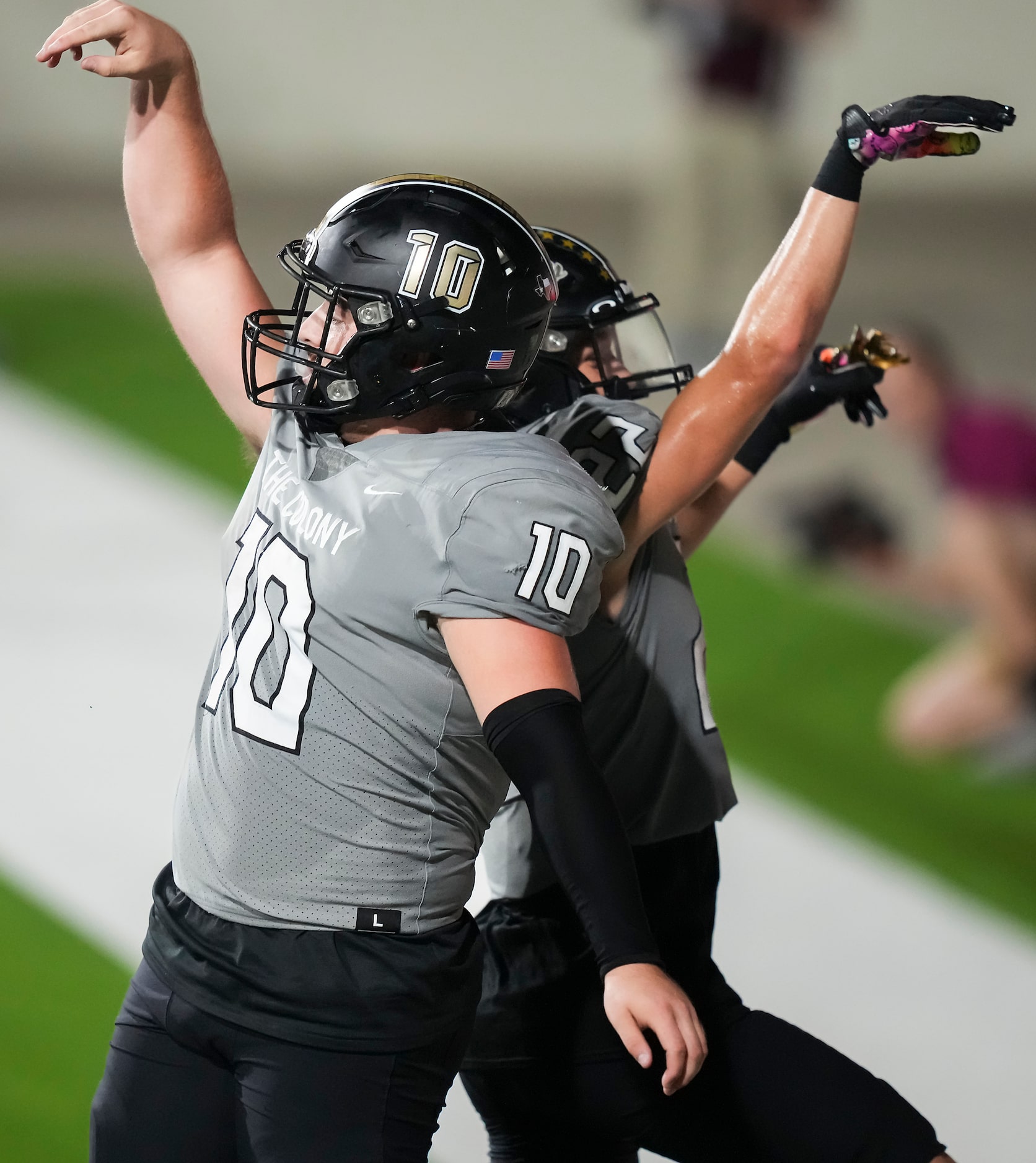 The Colony quarterback Carson Cox (10) celebrates with wide receiver Xavier Green (22) after...