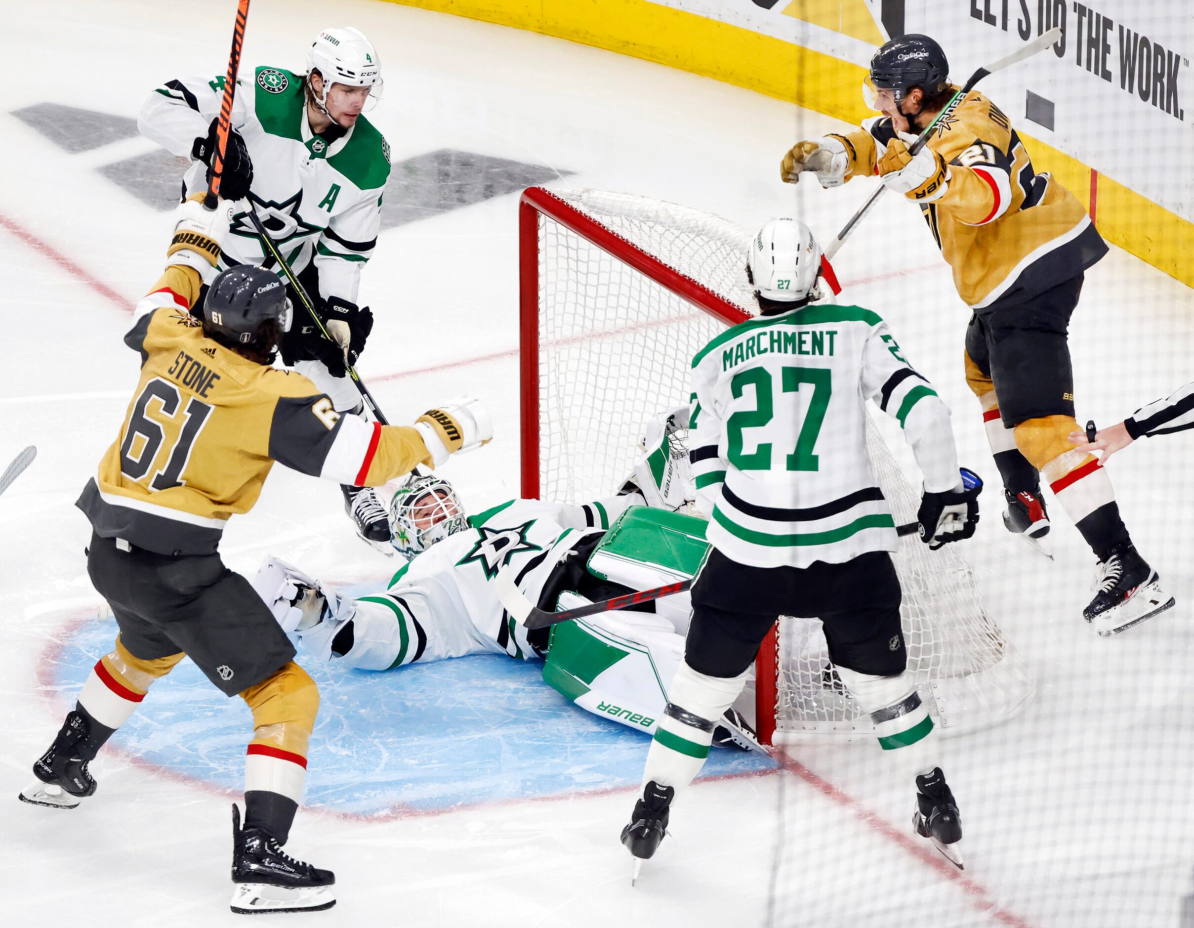 Dallas Stars goaltender Jake Oettinger (29) fans on his back as he’s scored on by Vegas...