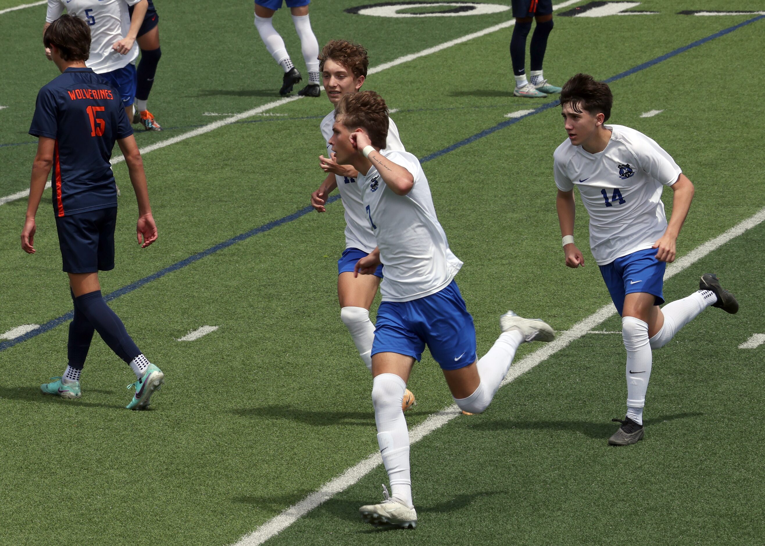  Midlothian midfielder Caden Naizer (7) , center, gestures toward fans in the stands as they...