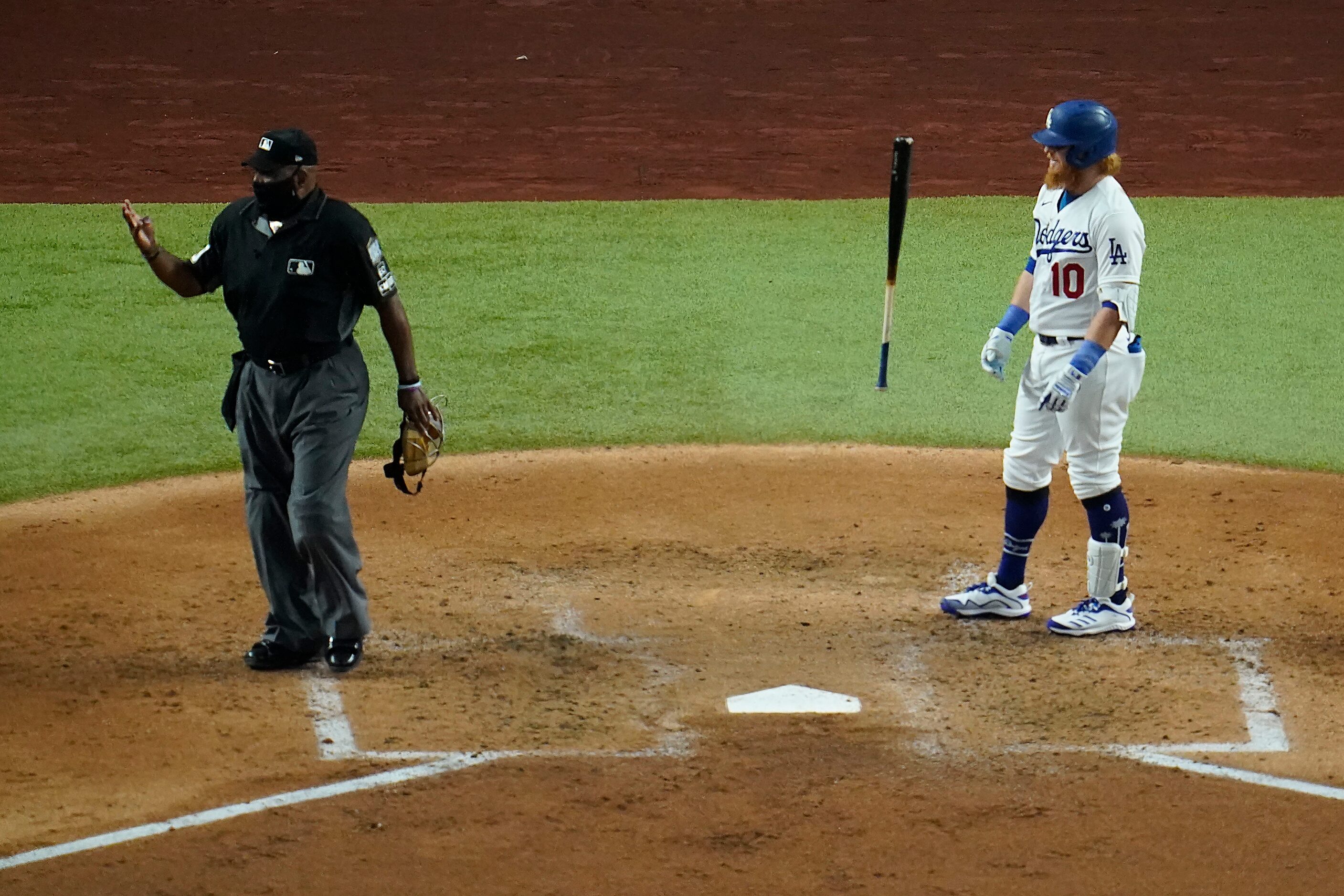 Los Angeles Dodgers third baseman Justin Turner (10) reacts after being called out on stikes...