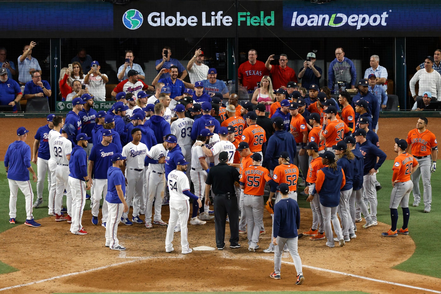 The benches clear during the eighth inning after Texas Rangers right fielder Adolis Garcia...