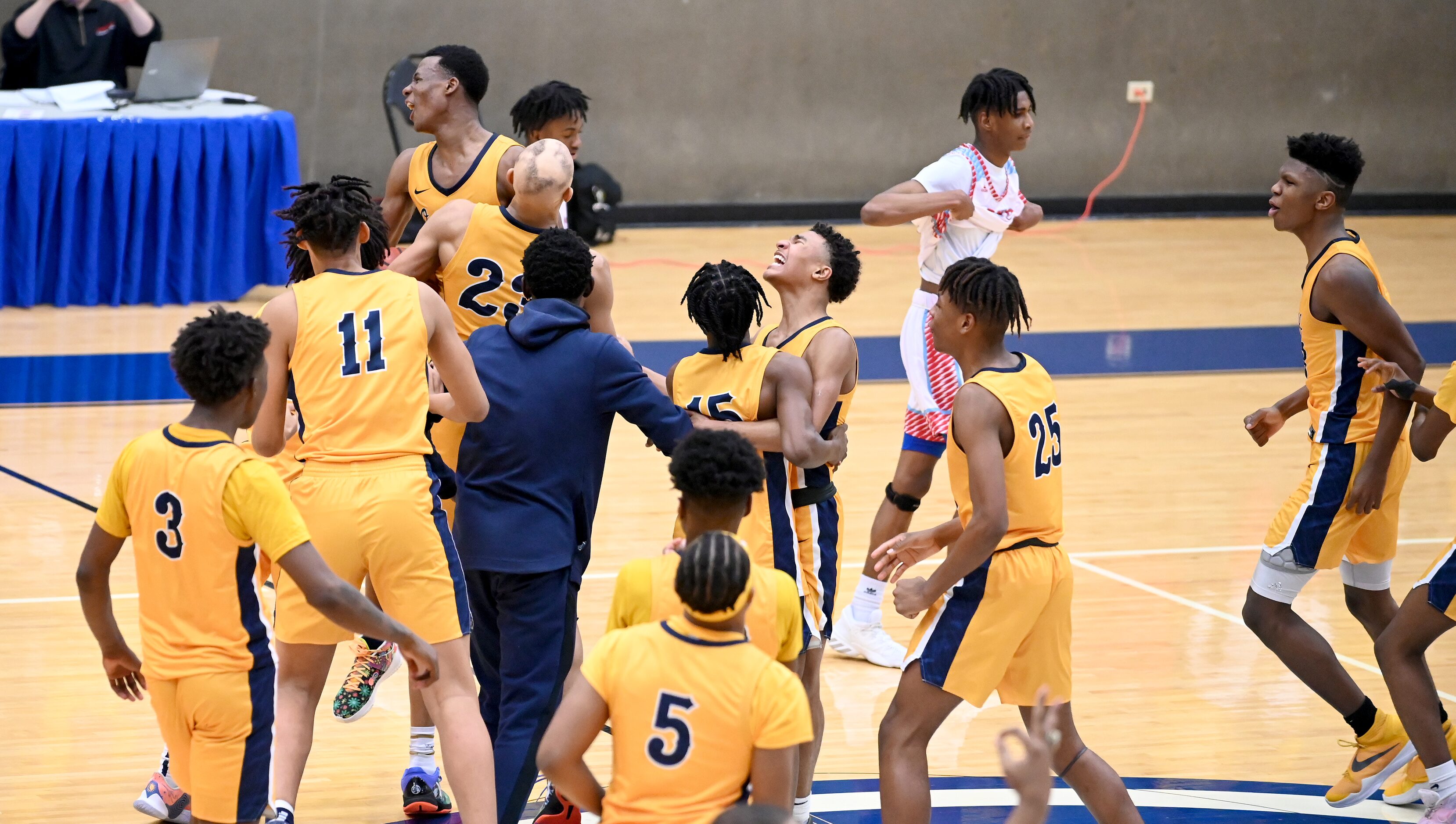 Faith Family team members celebrate their win of a Class 4A Region II final boys playoff...