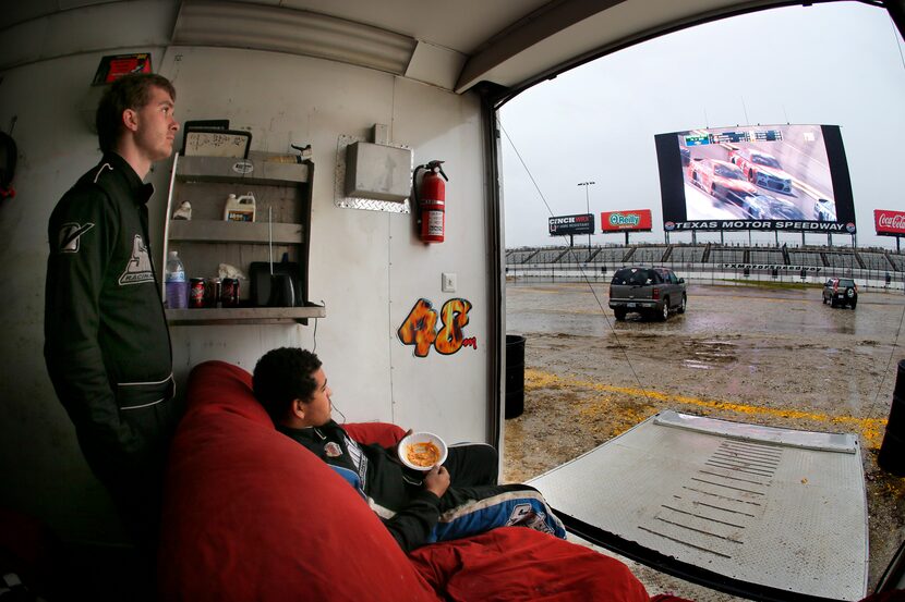 Racing fans Marshal McKelvy of Kennedale (left) and Tony Dowd of Mansfield watched the...