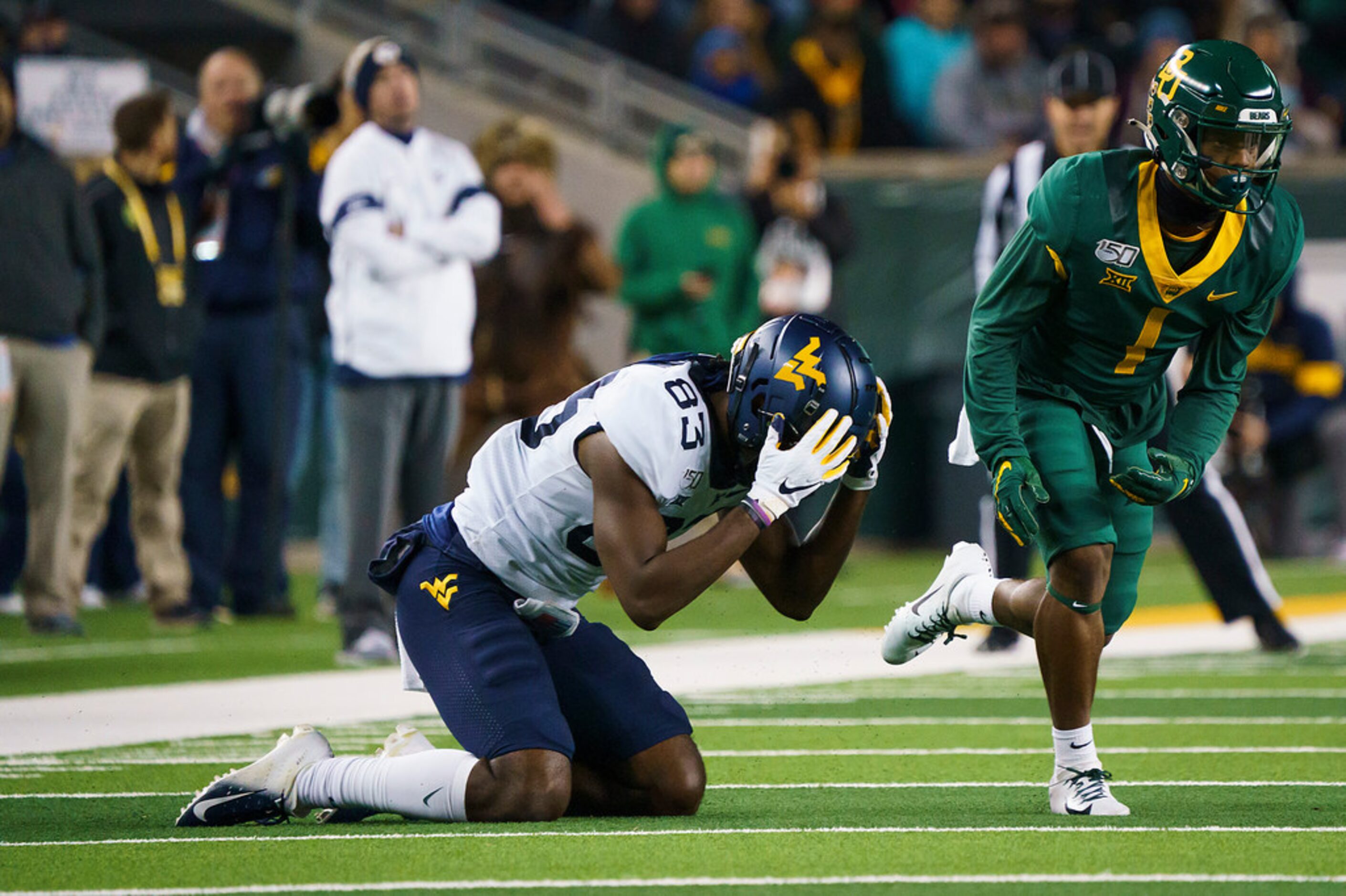 West Virginia wide receiver Bryce Wheaton (83) reacts after missing a pass with Baylor...