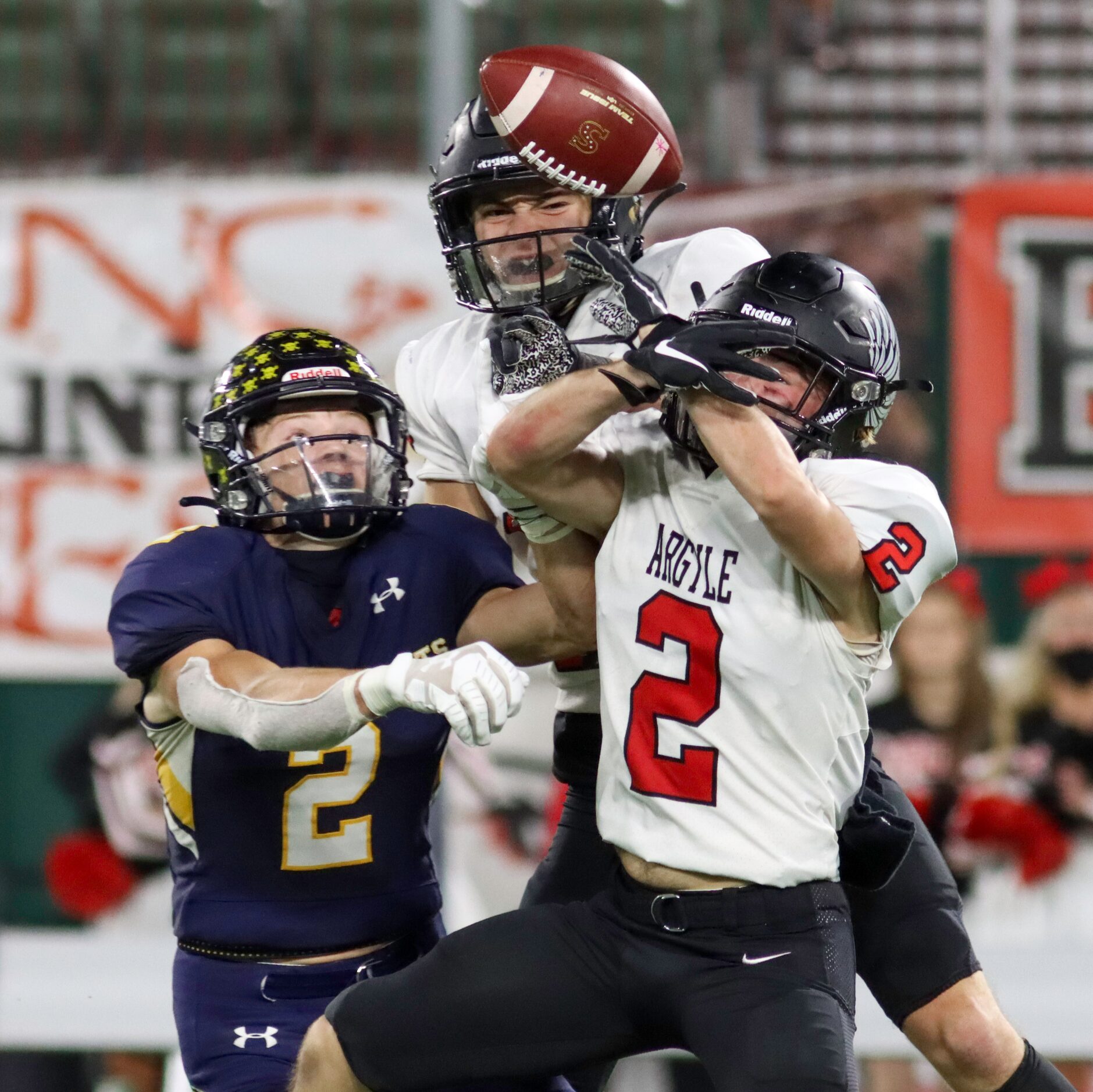 Argyle defensive backs Cash Walker (2) and Rand Nash (18) break up a pass intended for...