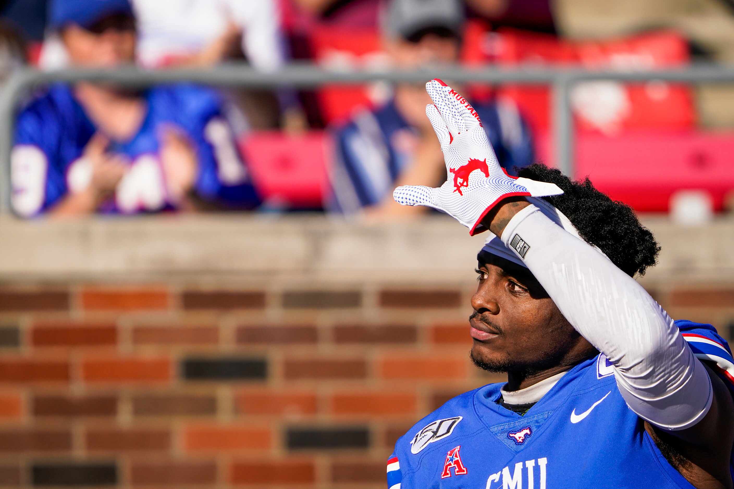 SMU wide receiver James Proche waves to the crowd as he takes the field during senior day...