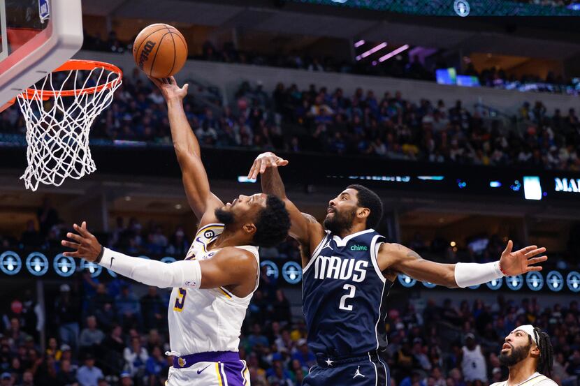 Dallas Mavericks guard Kyrie Irving (2) defends a shot from Los Angeles Lakers guard Malik...