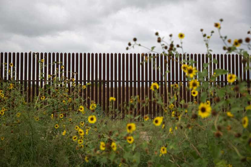 This photo shows a section of the US-Mexico border fence on June 18, 2018 near San Benito,...