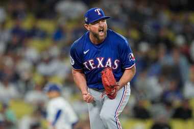 Texas Rangers relief pitcher Kirby Yates reacts after striking out Los Angeles Dodgers' Will...
