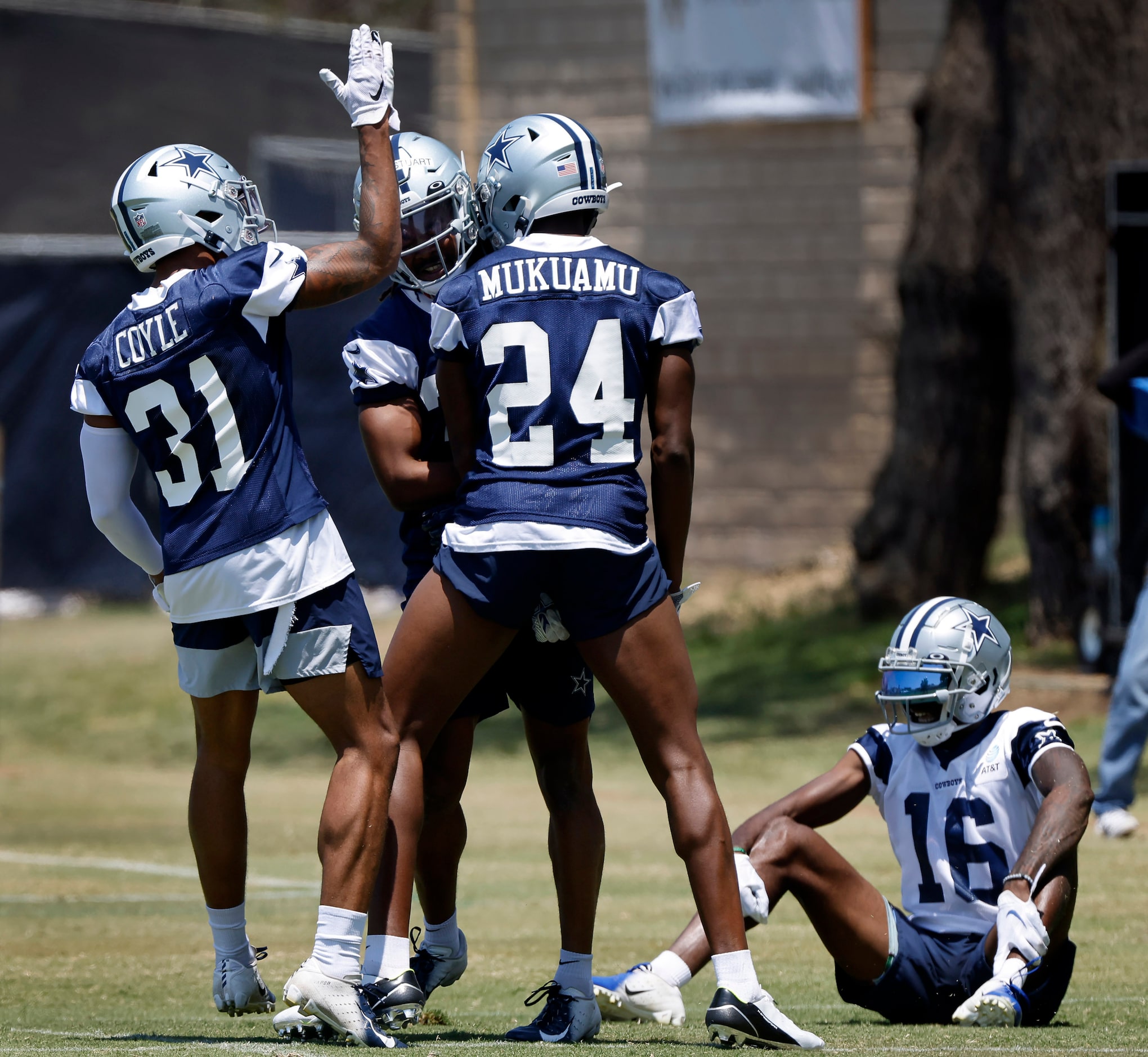 Dallas Cowboys cornerback Isaac Taylor-Stuart (36) is congratulated by teammates Tyler Coyle...