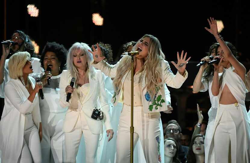 Kesha (center) performs with Bebe Rexha (left), Cindy Lauper (third from left) and Camila...