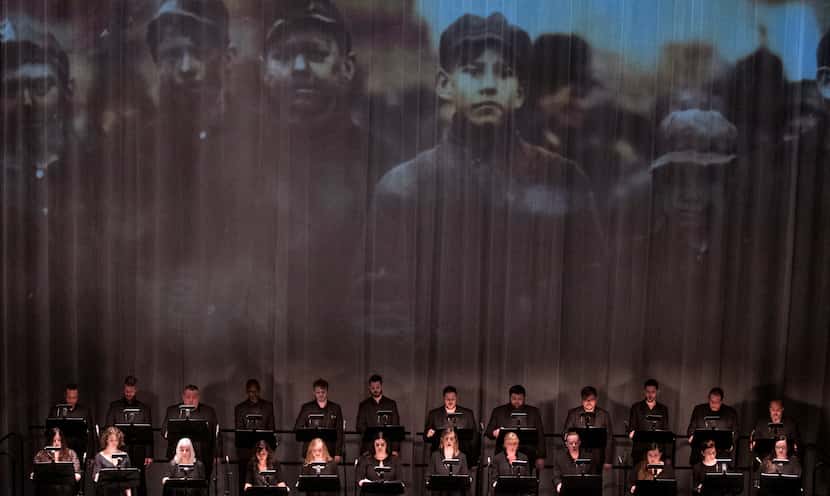A photo of young coal miners was projected during the Verdigris Ensemble's performance of...