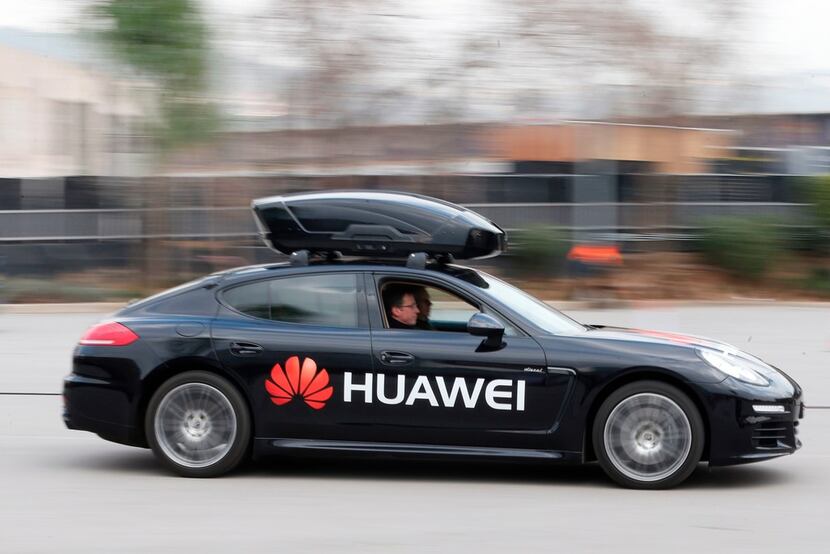 A Huawei Mate 10 Pro smartphone is used to drive a Porsche Panamera outside the Camp Nou...
