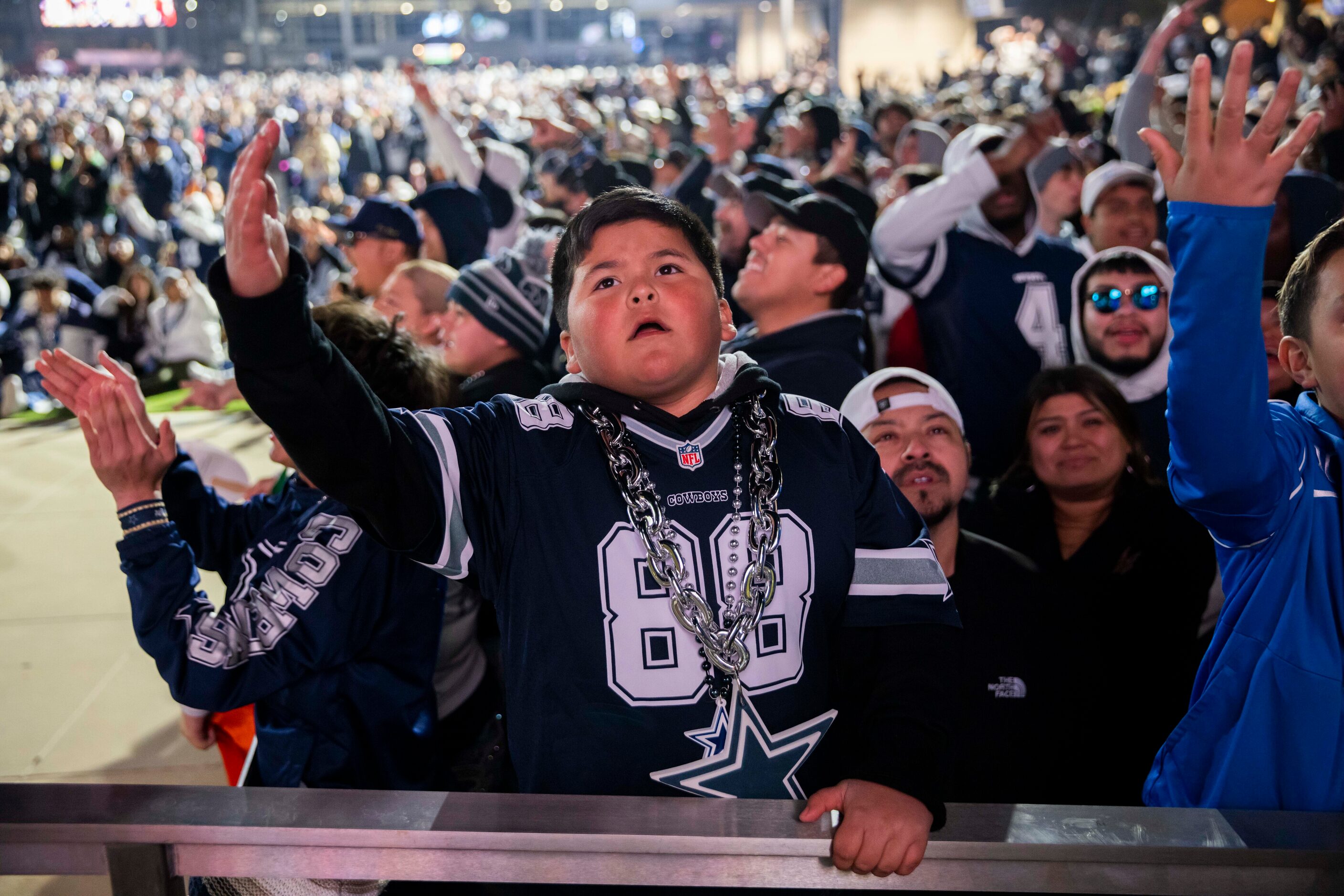 Isaiah Chávez, 10, reacts to a play by the Dallas Cowboys against the San Francisco 49ers in...