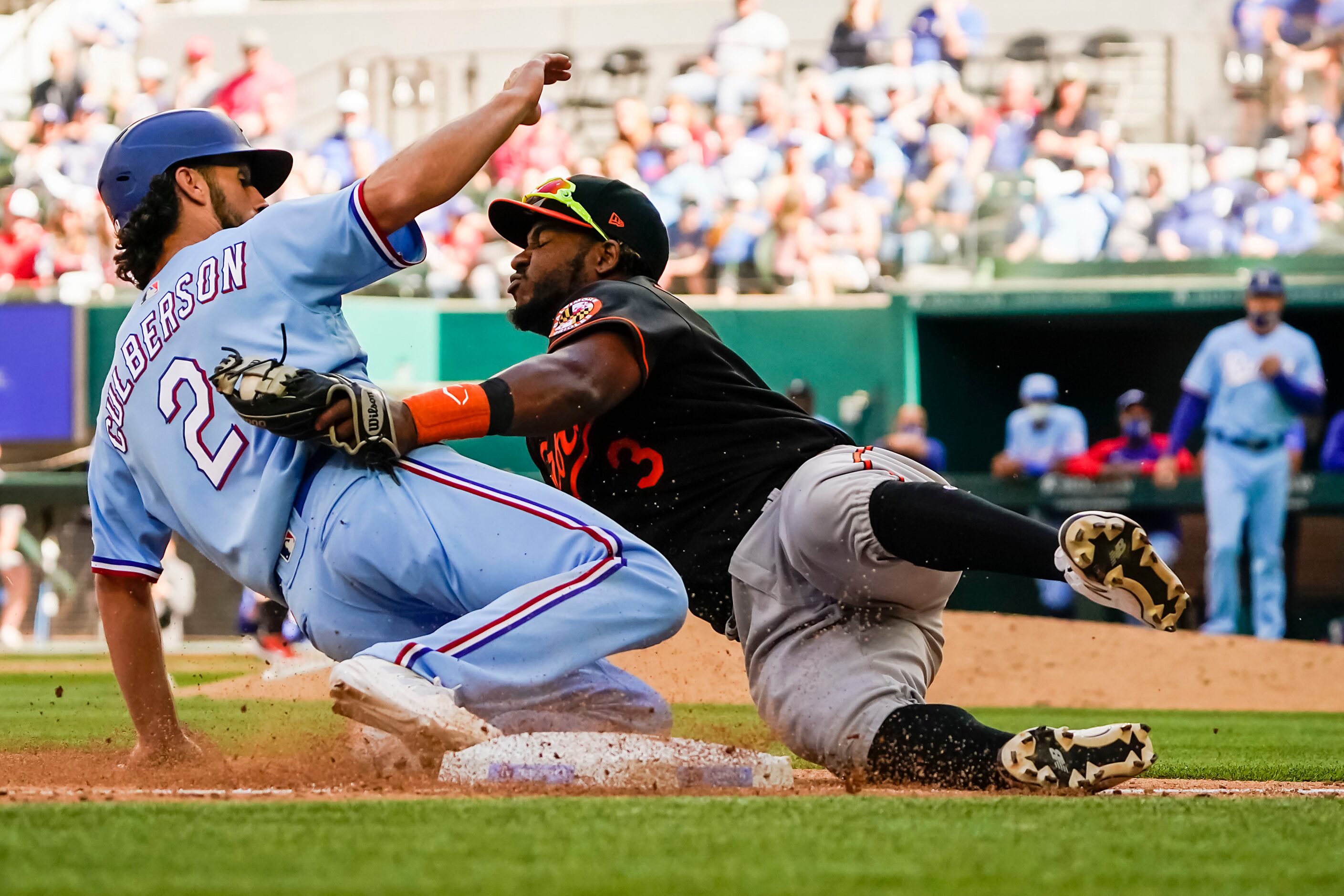 Texas Rangers infielder Charlie Culberson is out at third as Baltimore Orioles third baseman...