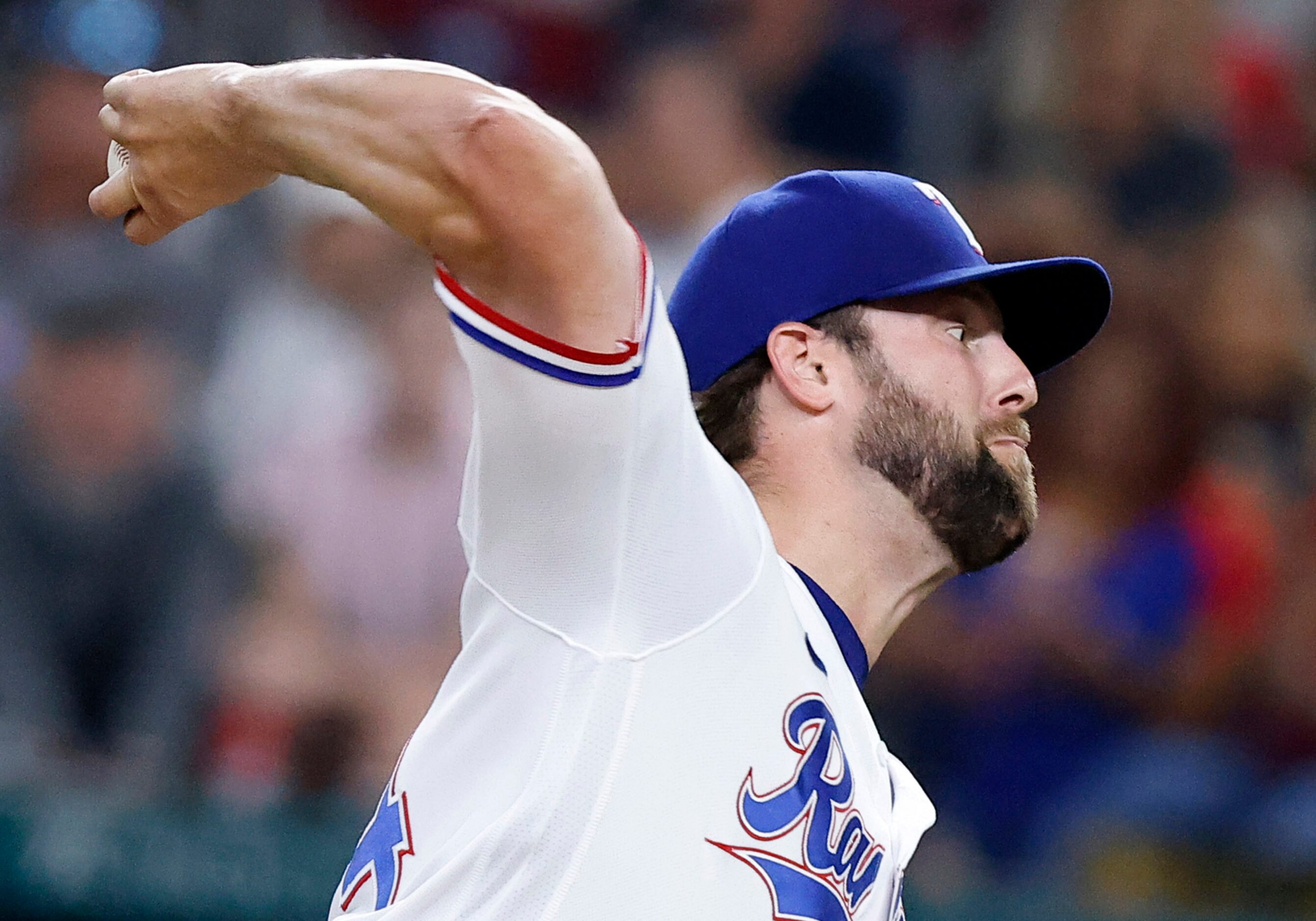 Texas Rangers starting pitcher Jordan Lyles (24) throws against the Oakland Athletics during...