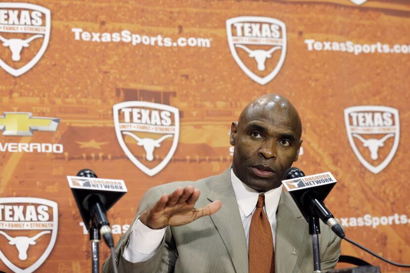 New Texas head coach Charlie Strong answers at his introductory press conference, Monday,...