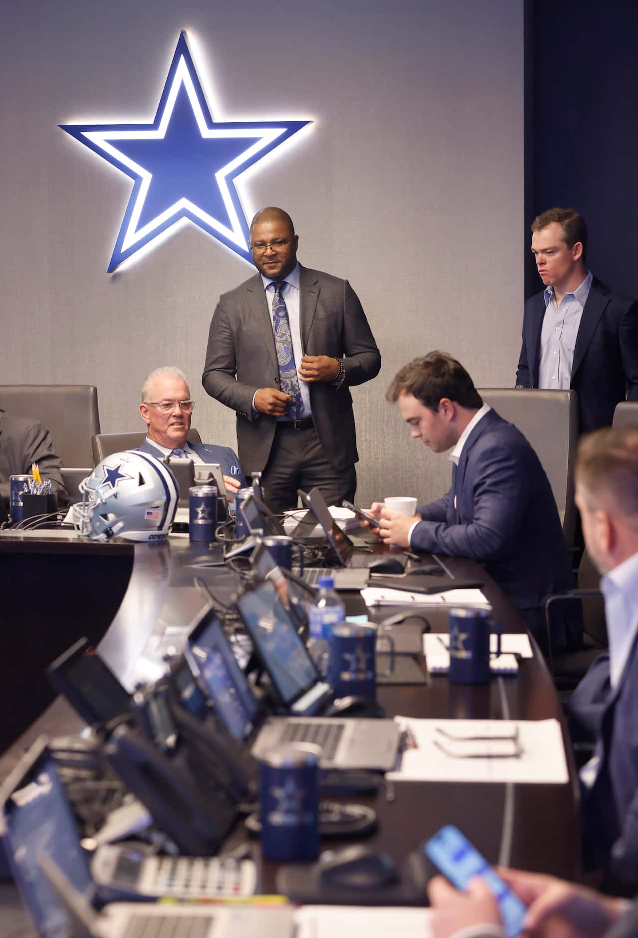 Dallas Cowboys executive vice president & CEO Stephen Jones (seated left) and vice president...